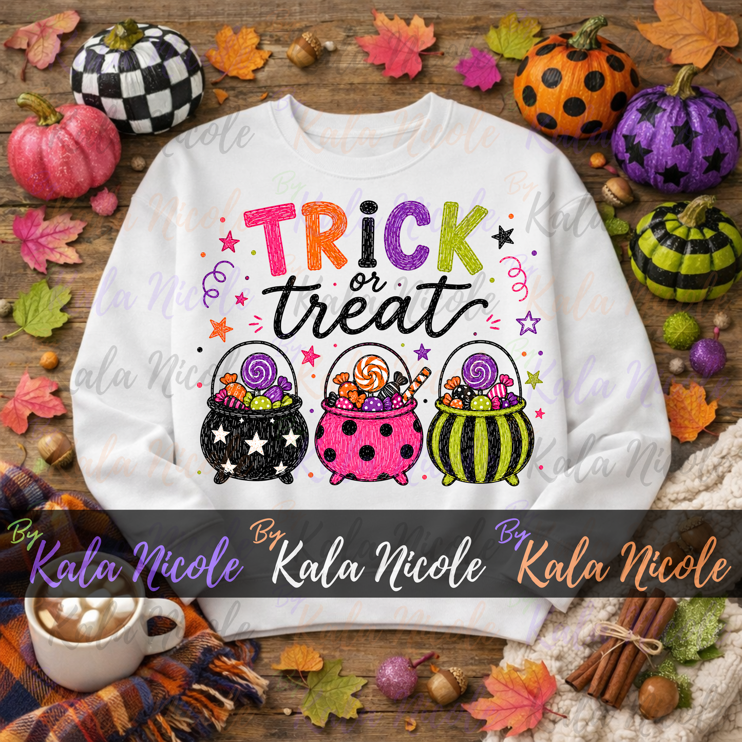 A white crewneck sweatshirt with a colorful 'Trick or Treat' graphic featuring three candy-filled witch hats, surrounded by autumn decorations like pumpkins, fall leaves, and a mug on a wooden surface. A watermark banner for 'Kala Nicole' is overlaid across the bottom.
